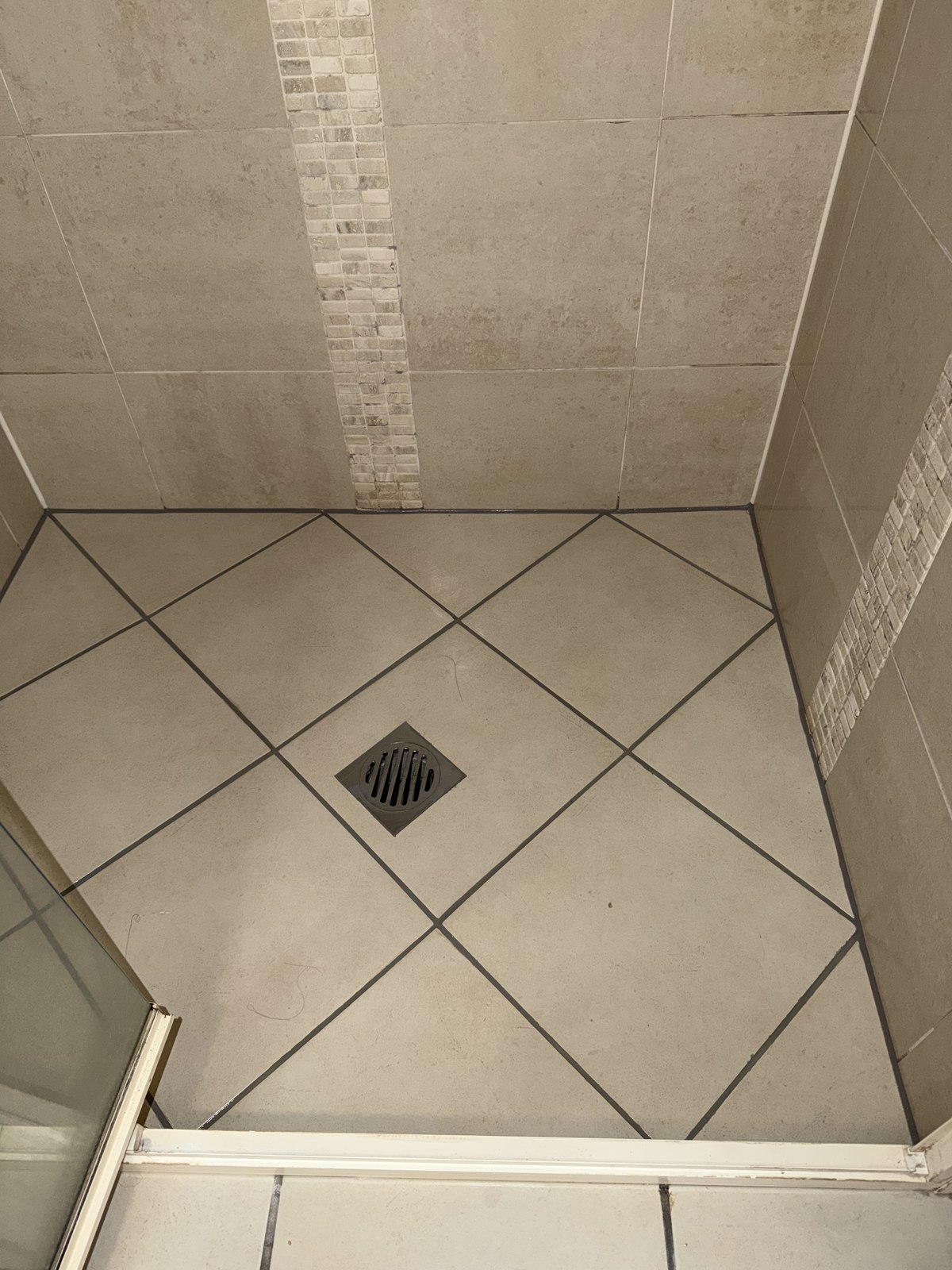 Diamond-set epoxy grouted shower floor by GC Grout Masters