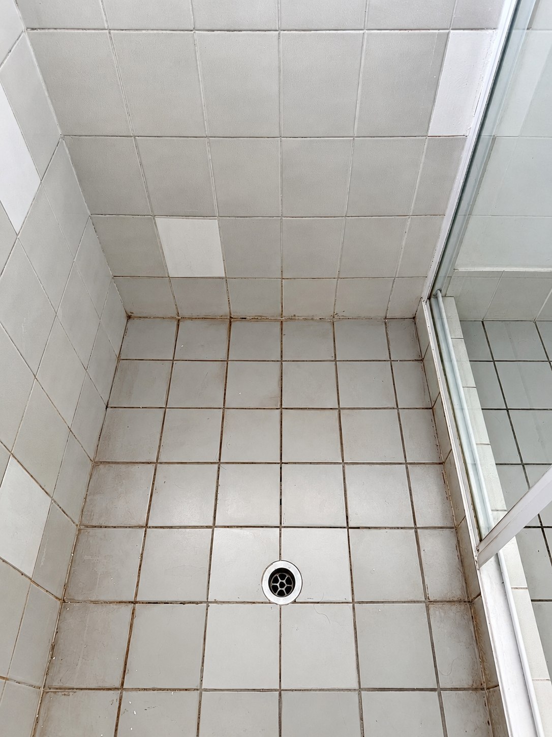 Shower before regrouting by GC Grout Masters